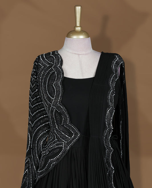 Black colour stitched gown set with sleeveless square‑neck bodice, attached pleated flare, and one‑side draped dupatta highlighted with heavy silver sequin and mirror work borders.
