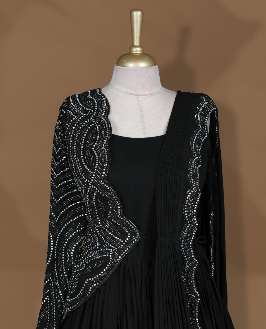 Black colour stitched gown set with sleeveless square‑neck bodice, attached pleated flare, and one‑side draped dupatta highlighted with heavy silver sequin and mirror work borders.