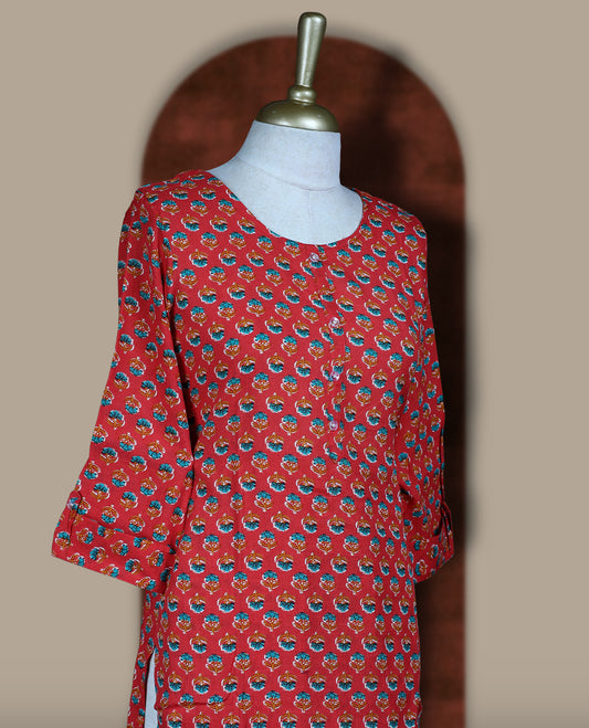 Red colour coord set adorned with all over floral prints, featuring a straight cut kurta with round neckline and 3/4th sleeves, paired with matching bottoms.