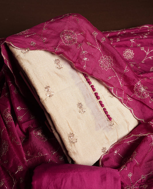 Golden Cream colour churidhar material featuring thread embroidery on the front panel, contrast maganta colour dupatta with elegant border, and matching plain bottom
