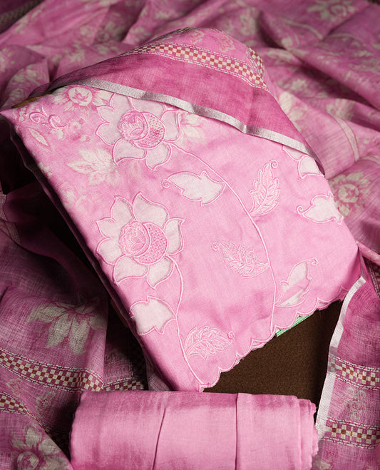 Pastel Magenta colour churidhar material featuring floral and cutwork embroidery on the front panel, digital floral printed dupatta with elegant border, and matching plain bottom.