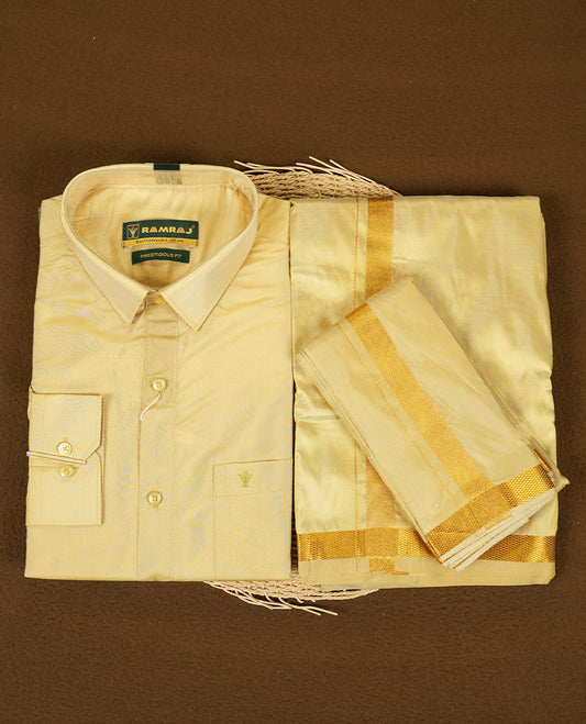 Dark Gold Colour shirt by RAMRAJ paired with a matching dhoti, all elegantly finished with a gold border.