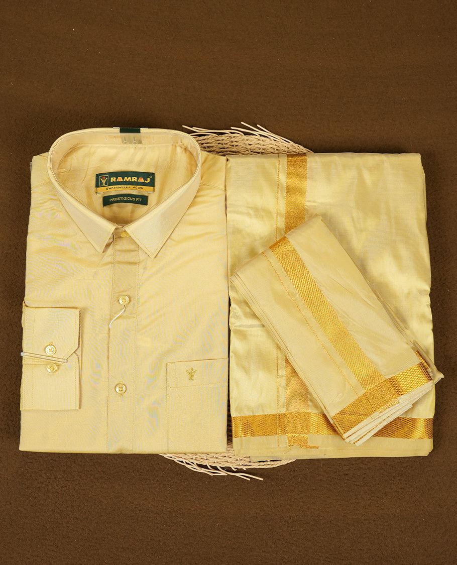 Dark Gold Colour shirt by RAMRAJ paired with a matching dhoti, all elegantly finished with a gold border.