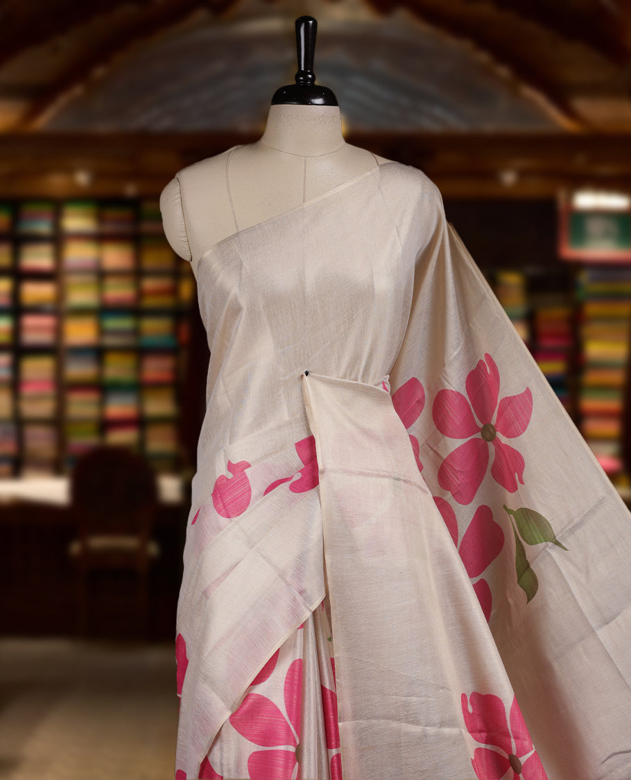 Beige colour Semi tissue saree adorned with pink colour digital Bold Floral Design on the body and an elegant pallu & comes with a matching blouse piece
