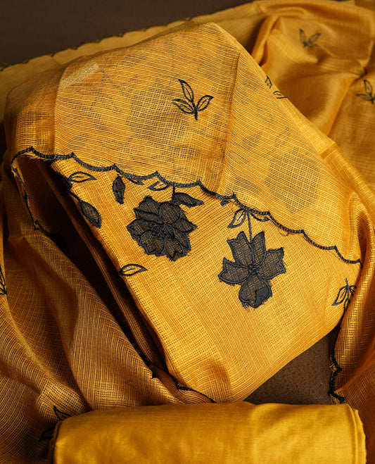 Yellow colour churidhar material featuring Black colour thread embroidery on the front panel, self colour dupatta with elegant border, and matching plain bottom