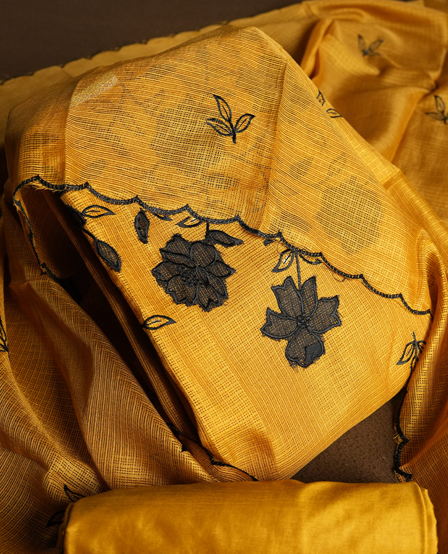 Yellow colour churidhar material featuring Black colour thread embroidery on the front panel, self colour dupatta with elegant border, and matching plain bottom