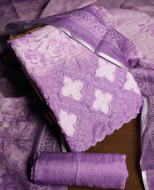 Lavender colour churidhar material featuring floral and cutwork embroidery on the front panel, digital floral printed dupatta with elegant border, and matching plain bottom.