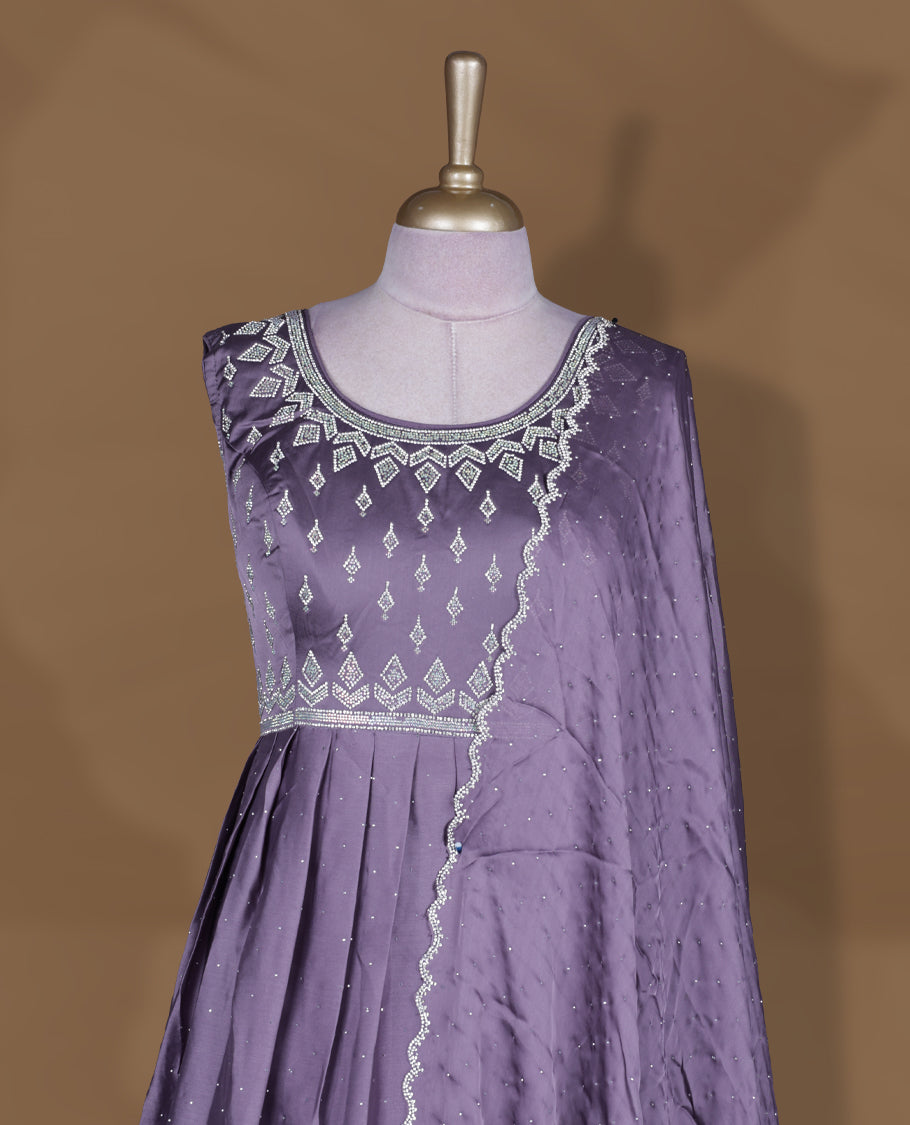 Dusty purple colour stitched gown set with sleeveless embroidered yoke, flared ankle‑length silhouette, and attached dupatta edged with scalloped beadwork and matching embroidered hem.