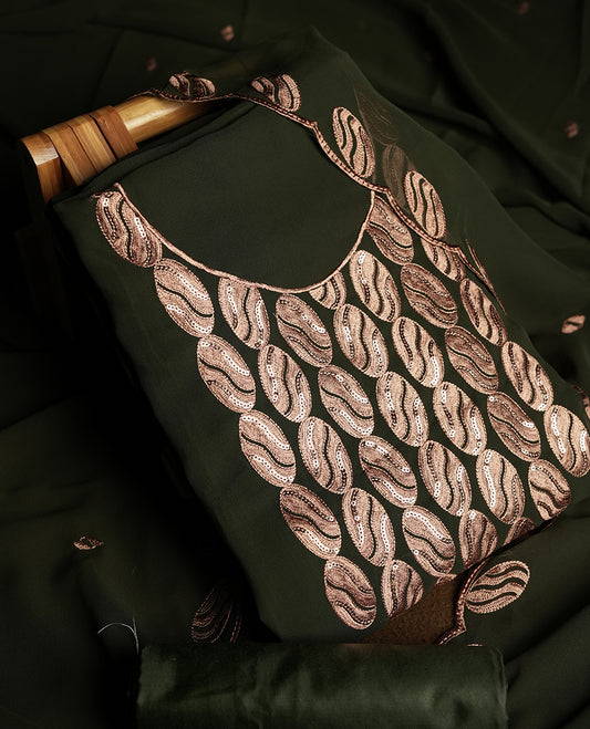 Dark Olive green colour churidar material adorned with intricate sequin embroidery on the neckline and body & dupatta comes with embroidered motifs and matching scalloped embroidered border & and plain bottom.