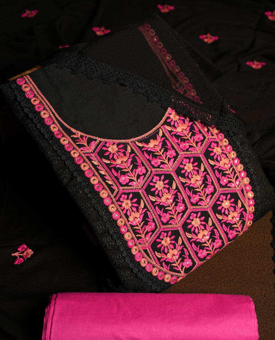 Black colour hakoba churidhar material featuring beautiful pink and peach colour floral embroidery on the neckline and front panel, highlighted with lace detailing & Comes with an embroidered dupatta and contrast pink colour bottom.