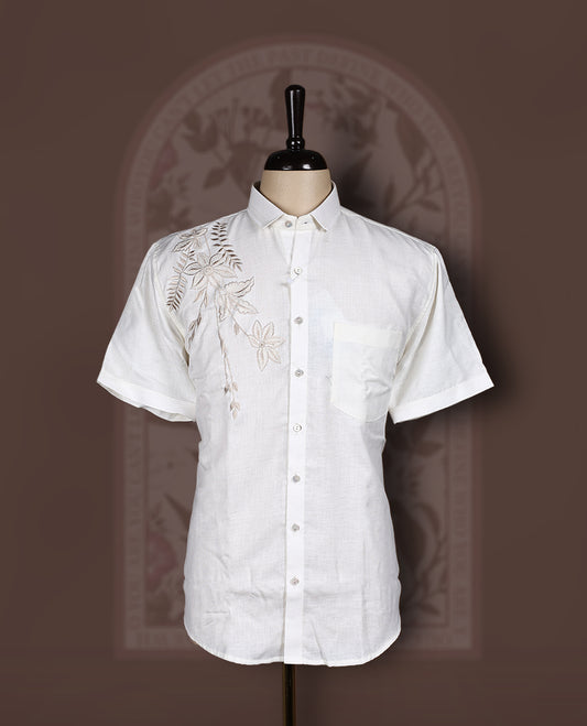 Off White colour cotton linen shirt featuring delicate embroidery work on the shoulder, designed with a mandarin collar and short sleeves for a refined yet comfortable style.