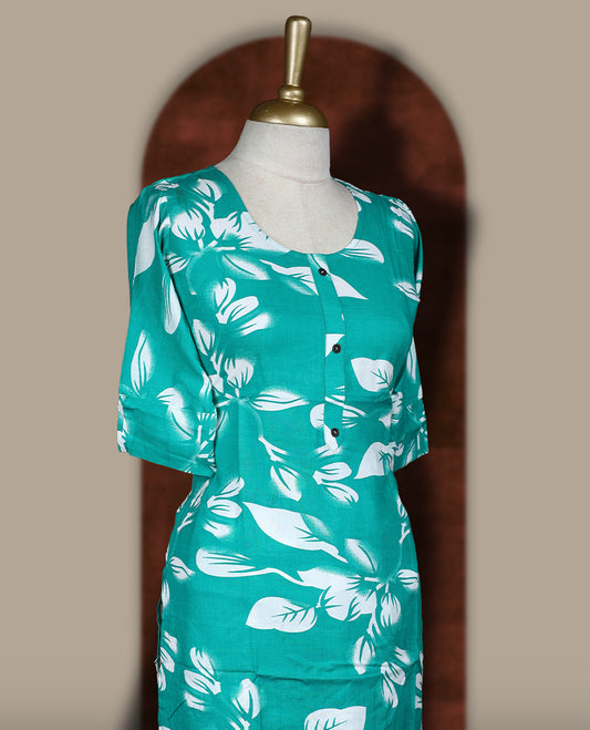Green colour coord set adorned with bold white floral prints on the body, featuring a straight cut kurta with round neckline and half sleeves, paired with matching bottoms.