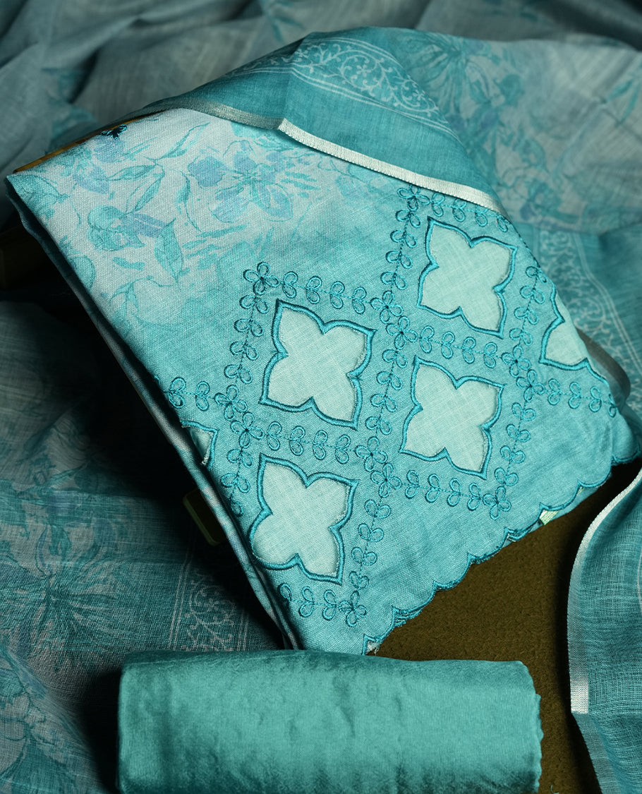 Pastel Aqua blue colour churidhar material featuring cutwork and thread embroidery on the front panel, floral digital printed dupatta with elegant border, and matching plain bottom.