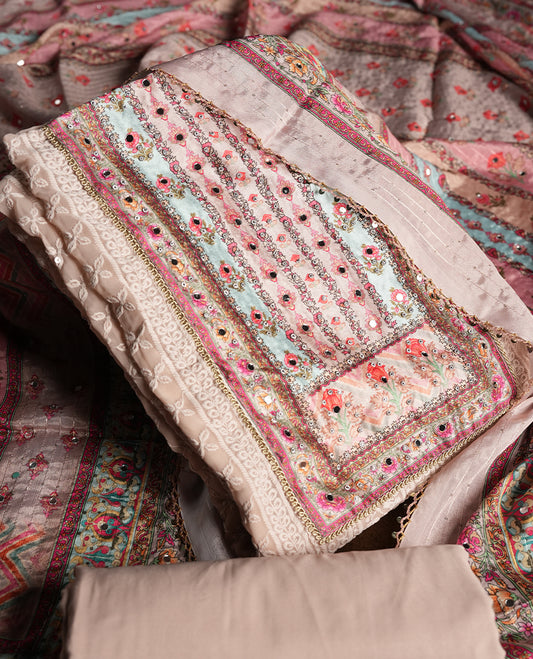 Walnut cream colour churidhar material featuring Mirror and thread embroidery, foral print pattern on the self colour front panel, floral digital printed dupatta with elegant border, and matching plain bottom