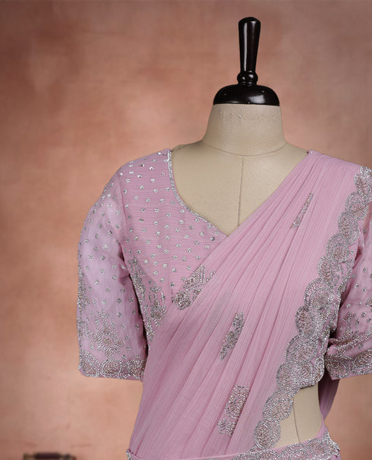 Elegant Baby Pink Colour ready to wear saree adorned with rich silver zari and bead embroidery along the border and pallu, paired with a heavily embellished matching blouse for a grand festive look.
