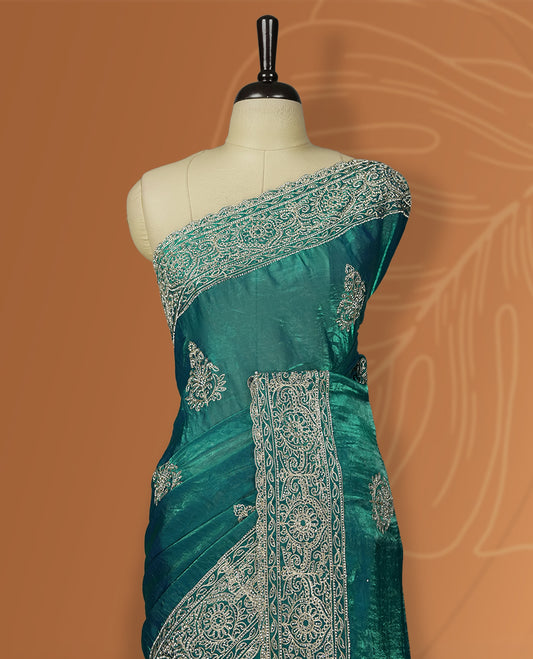 Double shaded Blue colour velvet chiffon designer saree in elegant two tone shades, featuring light gold zari, kodi work with handwoven style thread aari & dori embroidery work, Swarovski stone work and all over motifs, comes with matching blouse.