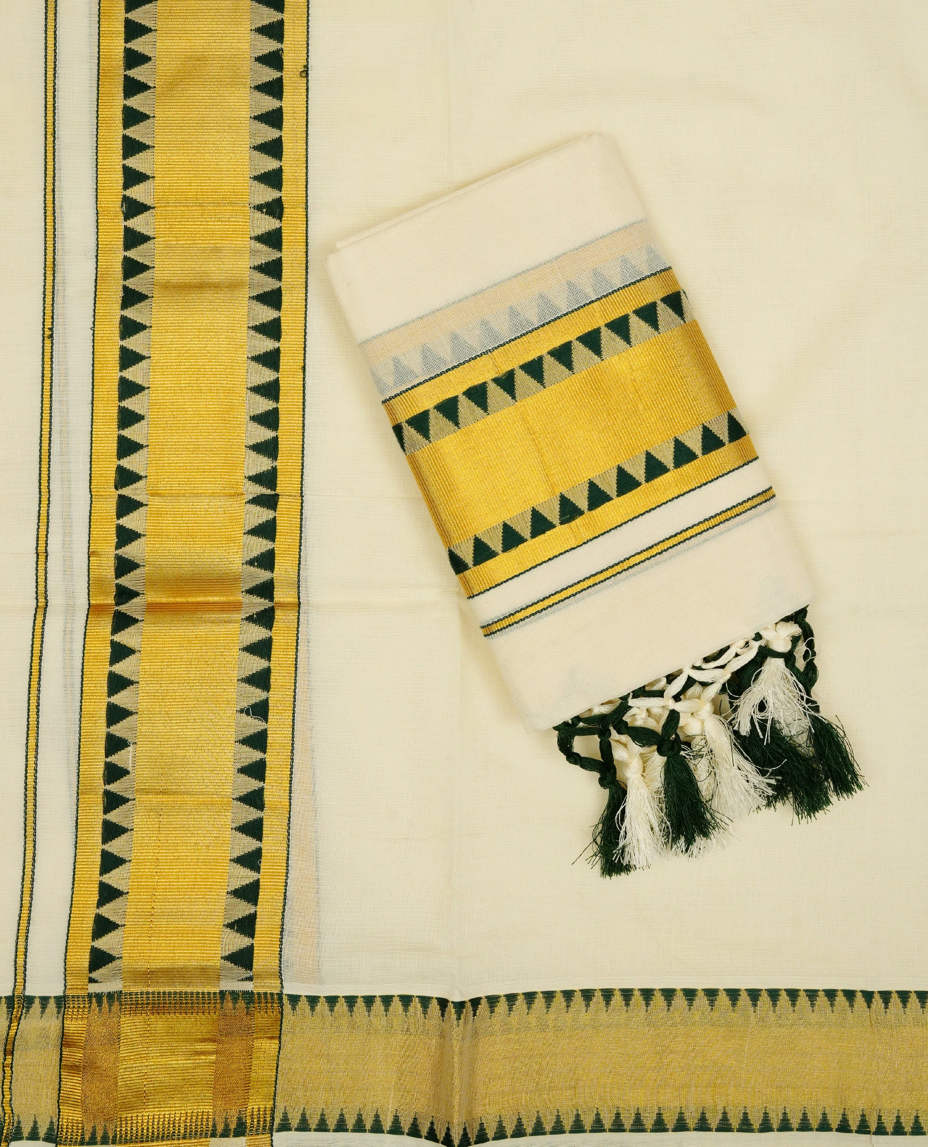 Cream colour Cotton set mundu With plain body, enhance gold zari with Green temple design kara.