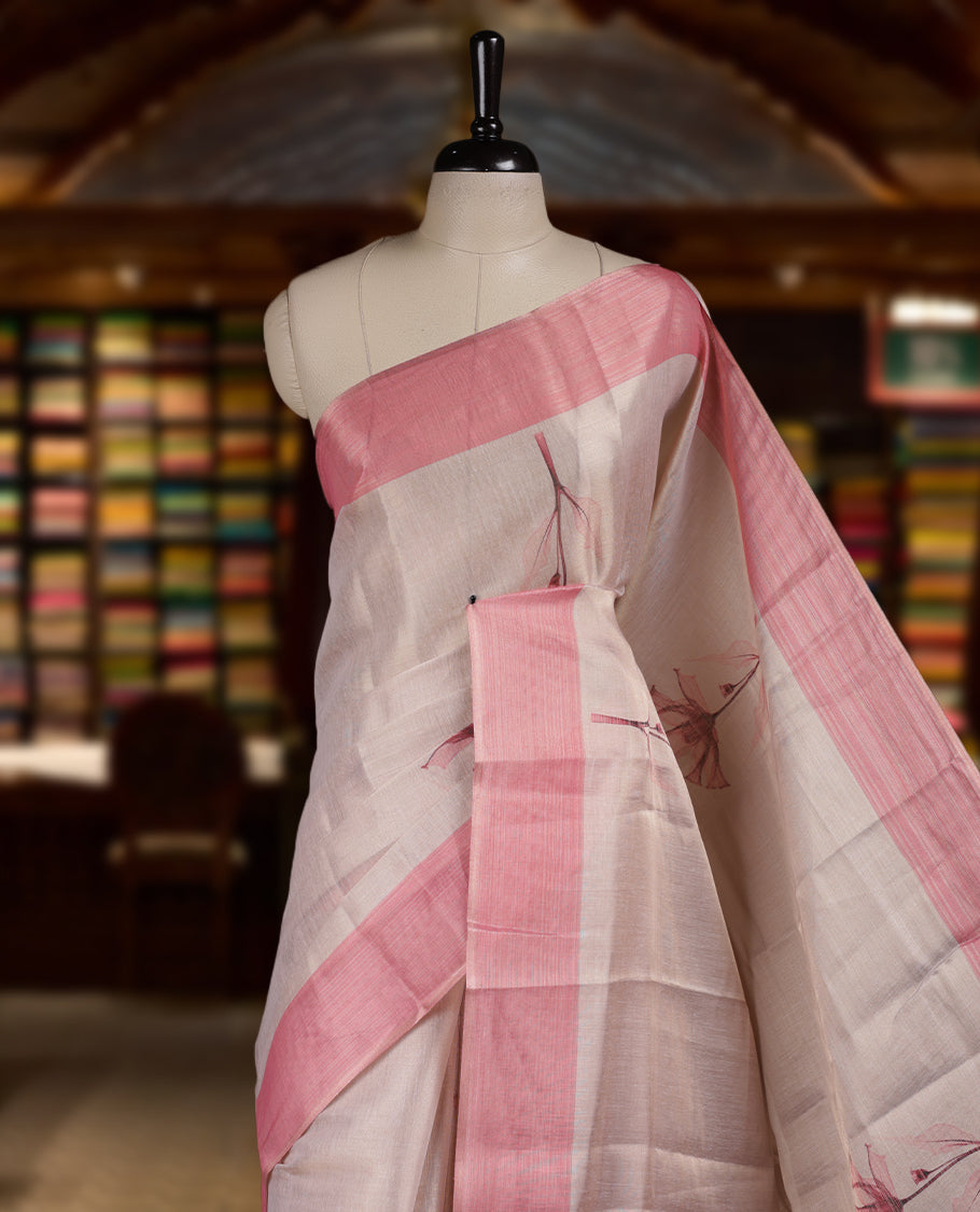 Beige colour Semi tissue saree adorned with Pink toned digital Floral prints on the body and an elegant pallu & comes with a matching blouse piece