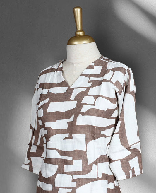 Saddle brown colour and white abstract print cord set featuring a V neck top with a front slit, paired with matching straight fit pants.