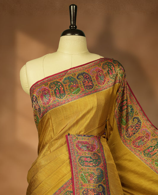 Mustard Pashmina Silk Saree with Plain Body, Featuring Exquisite Multicolor Elephant, Peacock, and Floral Motifs on Rich Pink-Green Zari Border & Grand Pallu, Paired with Matching Blouse Piece