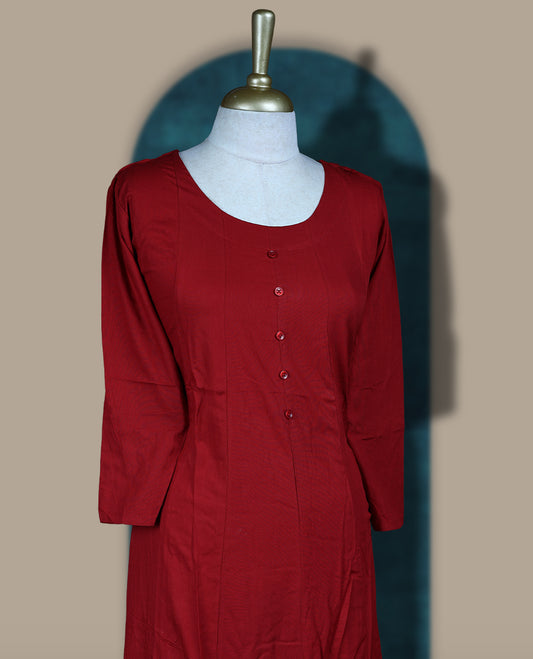 Maroon colour cotton kurthi with front buttons and 3/4th sleeves & Features a round neck and minimalist design for a classy everyday look, Ideal for work or casual wear with maximum comfort.