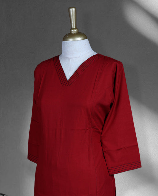 Maroon colour cord set featuring a plain V neck kurta with subtle stitch detailing on neckline and sleeves, paired with matching palazzo.