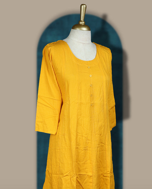 Gamboge yellow colour cotton kurthi with front buttons, 3/4th sleeves, and a round neckline & Perfect for daily wear, office, or layering, Soft, breathable fabric ensures all day comfort and ease.