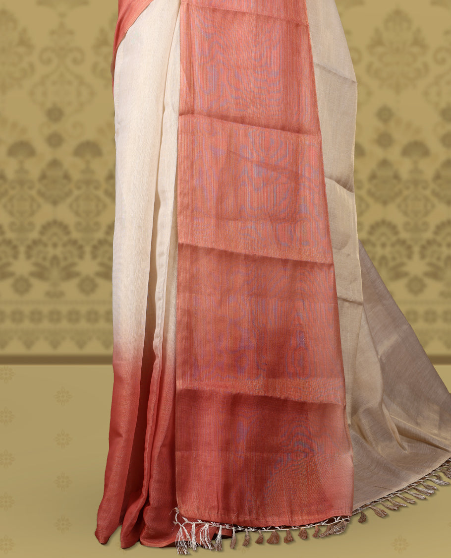 Beige and rust orange colour saree, featuring a smooth woven texture, The shaded rust pallu adds a refined charm & Finished with tassel detailing and comes with a matching blouse piece.