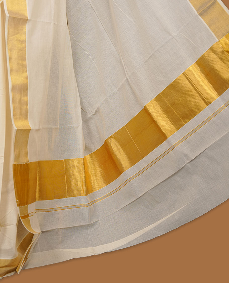 Off-white colour cotton Kerala saree crafted in a soft, sheer weave, finished with a classic gold kasavu border along the body and pallu, and paired with a matching blouse.
