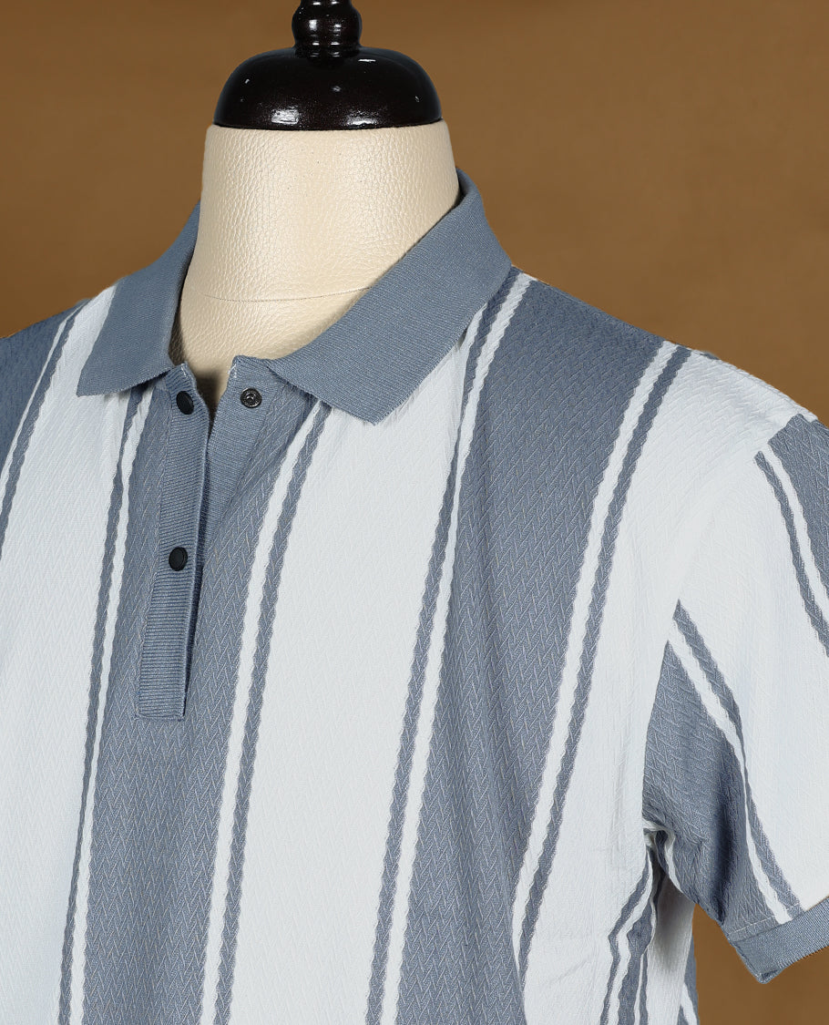 Grey and white striped men’s polo T shirt featuring a classic collar with button placket, short sleeves, and a regular fit crafted from soft, breathable fabric for everyday comfort and style