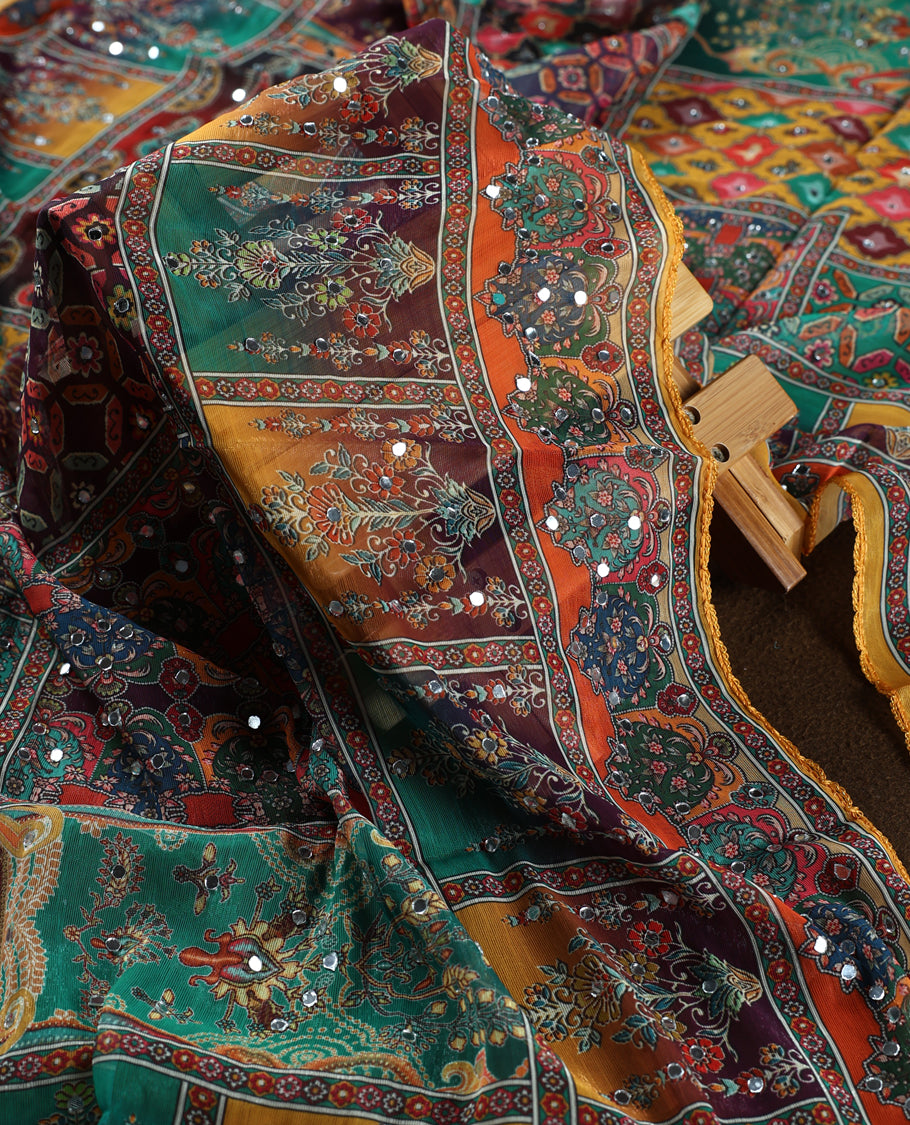 Yellow colour churidhar material with vibrant multicolour geometric and paisley prints, enhanced with delicate mirror work, paired with a plain matching bottom and bold printed dupatta, perfect for festive occasions.