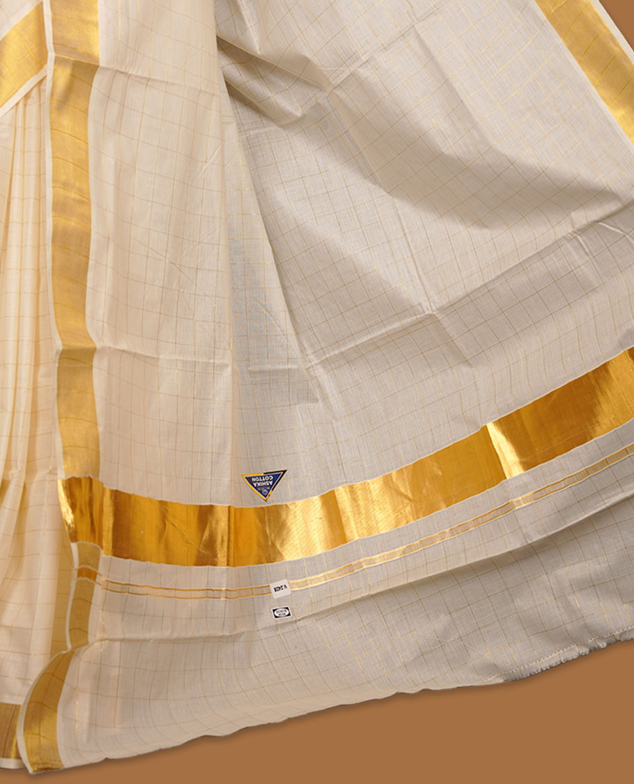Off-white colour cotton Kerala saree featuring a classic gold kasavu border, highlighted by subtle woven check patterns across the body and pallu, and paired with a matching blouse.