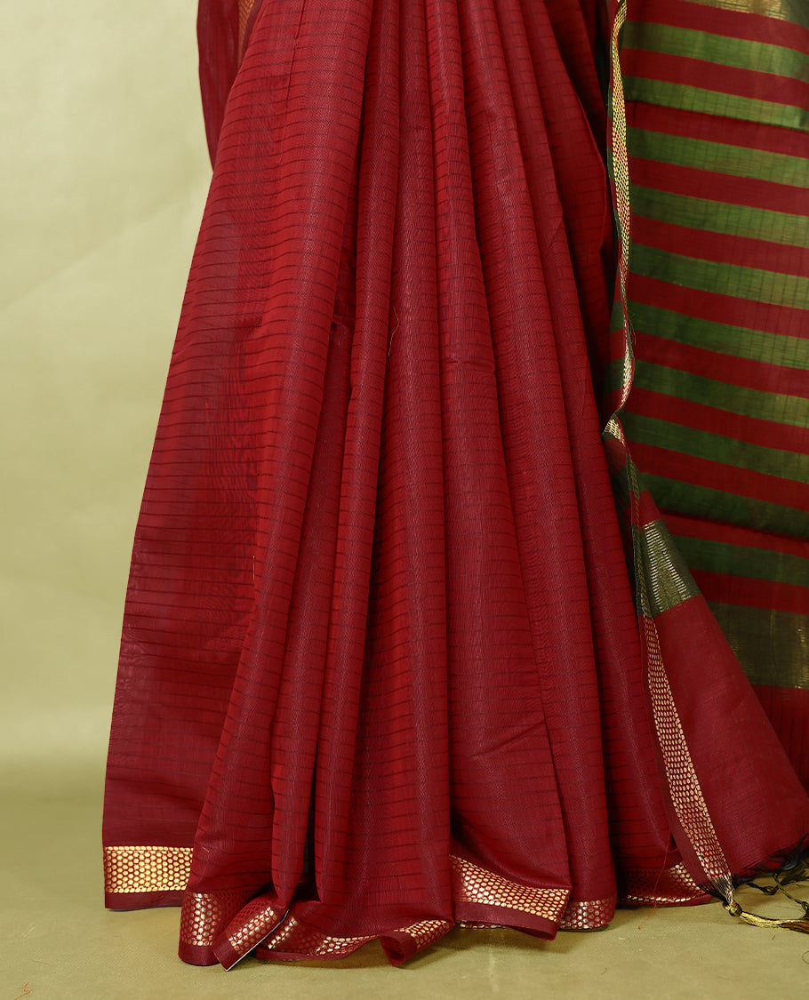 Deep Red colour chanderi cotton saree with fine striped body, mangalgiri border, grand pallu featuring olive Green and gold zari stripes, with matching blouse.