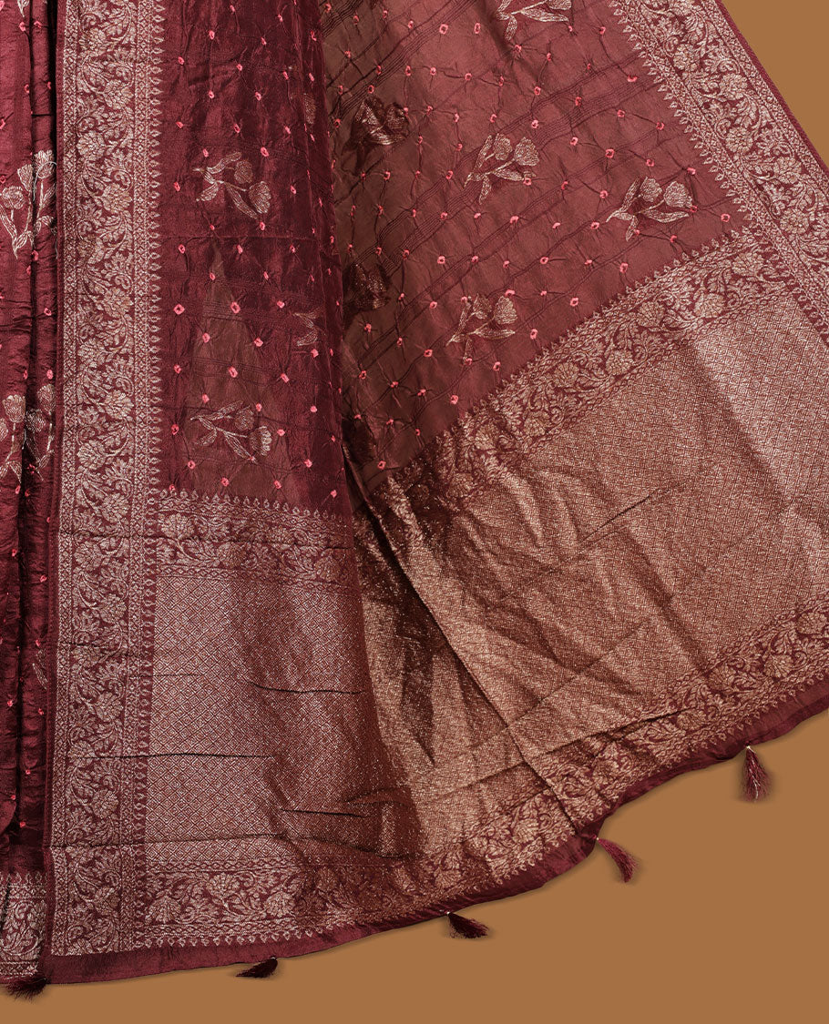 Deep brown colour Banarasi Bandhani silk saree featuring with intricate Banarasi motifs on body, complemented by antique zari woven border and grand pallu, paired with matching  blouse