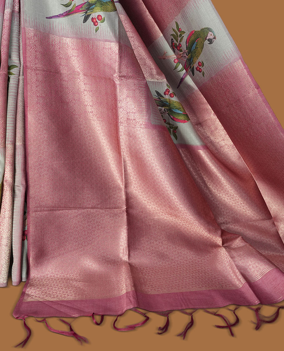 Dusty rose and silver colour semi tussar Banarasi saree featuring printed parrot and floral motifs, zari diamond buttas, a geometric gray-red zari border, and a matching blouse with woven accents.
