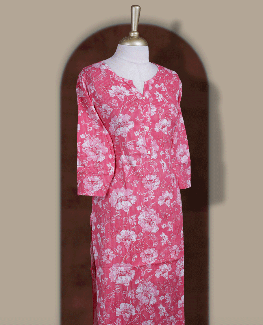Pink colour kurthi adorned with delicate pink and white colour floral prints all over, featuring a stylish V notch round neckline and comfy 3/4th sleeves.