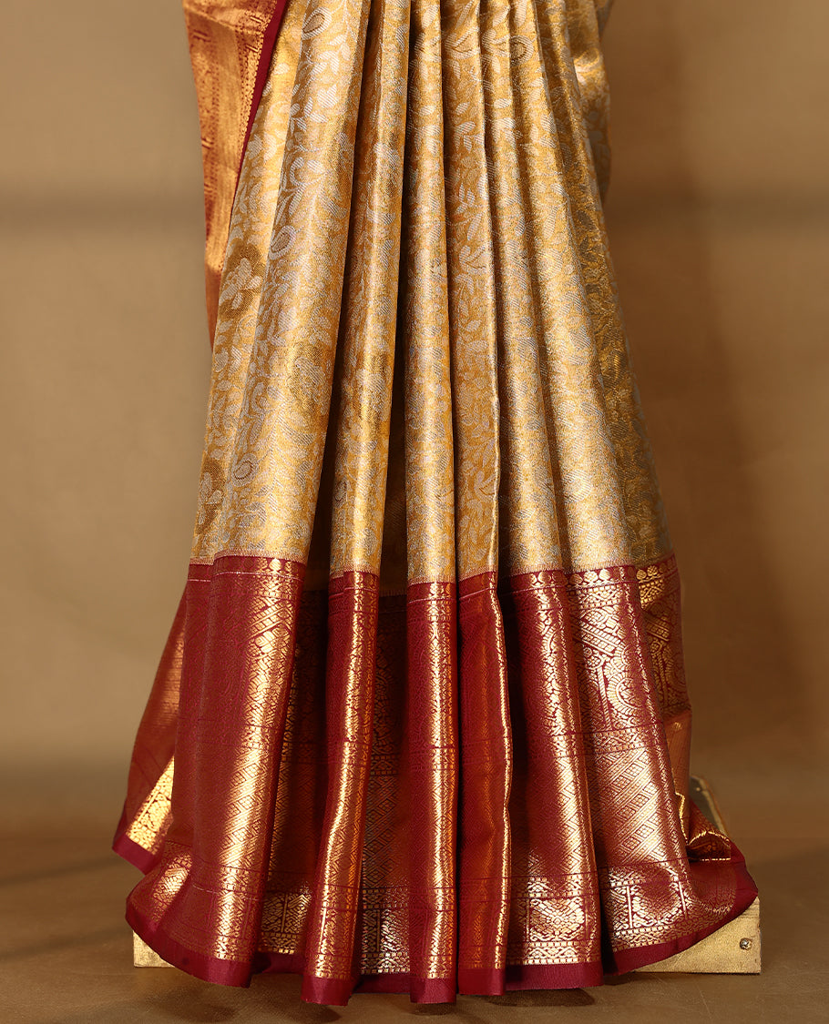Gold colour tissue brocade saree with gold and silver zari kodi pattern on body, gold zari traditional pattern work Deep Maroon border, rich matching pallu with Antique zari motifs, paired with matching blouse.