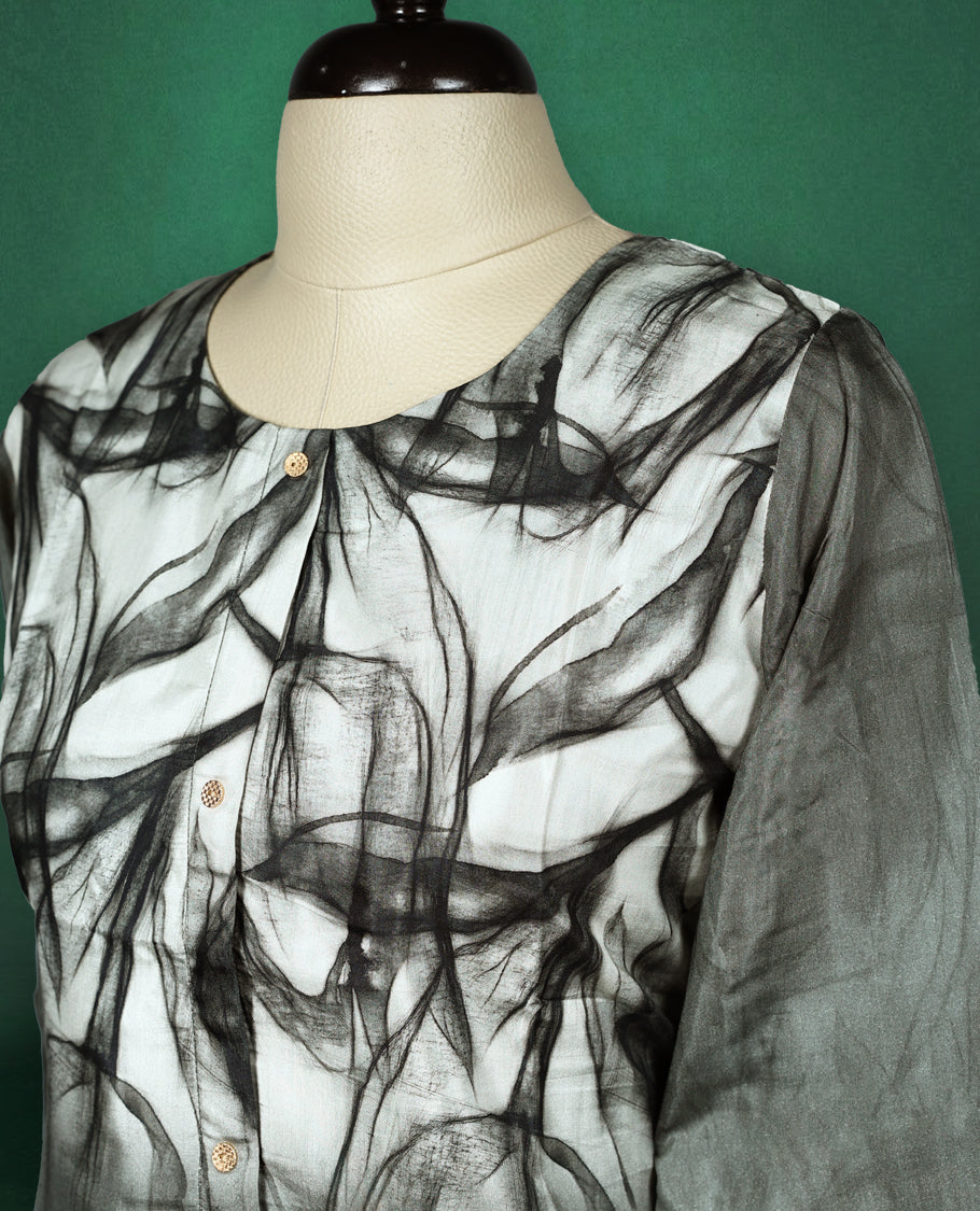 Stylish black and grey short kurti featuring a smoky abstract print, button down front, round neckline, and 3/4th sleeves perfect for a chic casual look.
