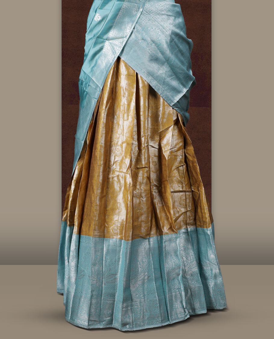 Ocean blue and mustard colour Dhavani set featuring a Mustard colour skirt with contrast ocean blue colour border with rich silver zari pattern & stone work, paired with a contrasting ocean blue dupatta detailed with silver motifs