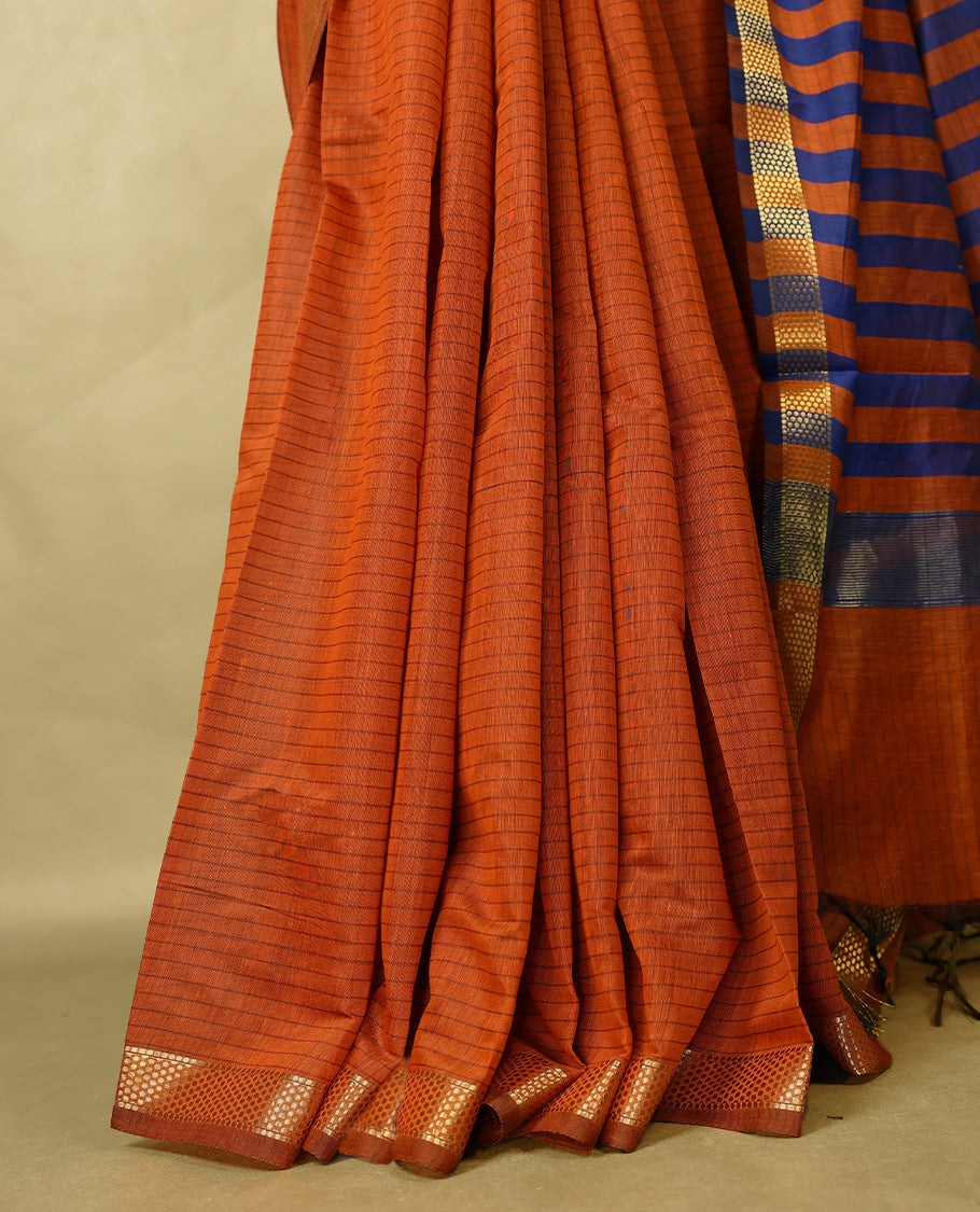 Deep Orange colour chanderi cotton saree with fine striped body, mangalgiri border, grand pallu featuring Blue and gold zari stripes, with matching blouse.