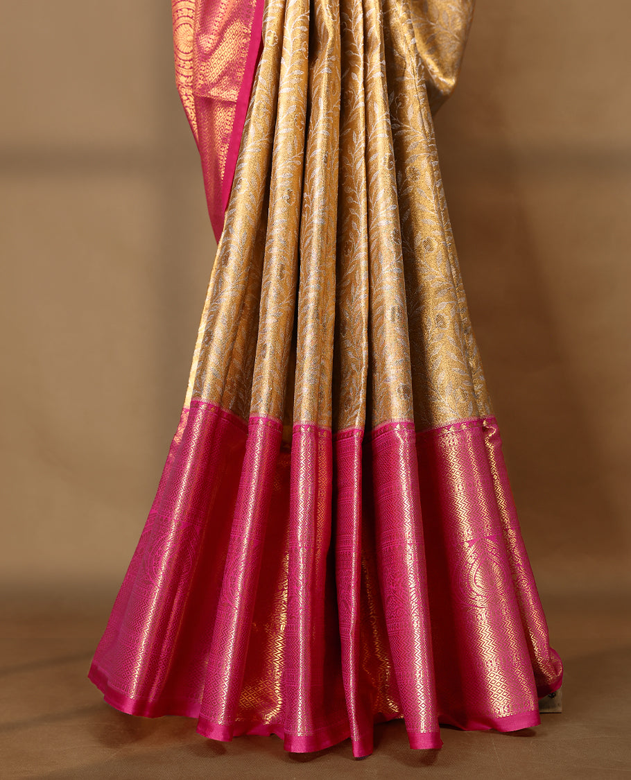 Gold colour tissue brocade saree with gold and silver zari kodi design on body, gold zari traditional magenta border, rich matching pallu with Antique zari motifs, paired with matching blouse.