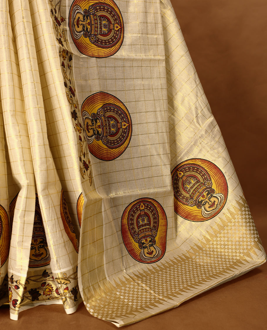 Light Gold colour Tissue Kerala saree featuring Kathakali motifs on the body, golden zari checks, and a beautifully woven border with Floral Printed motifs, paired with a matching blouse perfect for festive occasions.