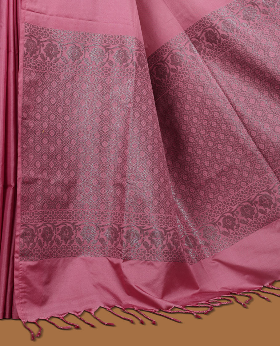 Pink colour semi soft silk saree adorned with delicate woven floral motifs on the body, complemented by a Self colour woven pallu with intricate detailing and tassel accents without border & Comes with a matching blouse piece.