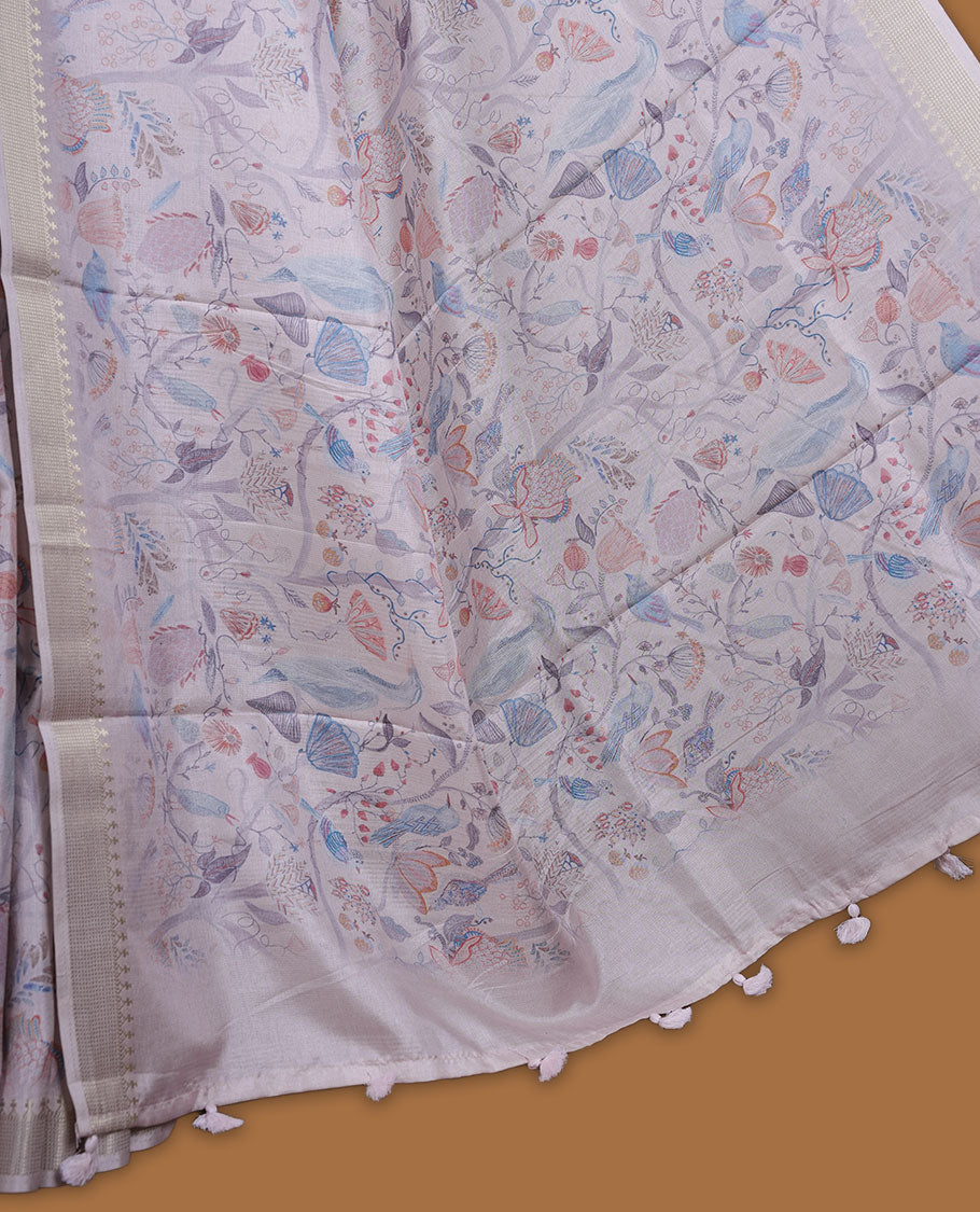 Light pink colour semi tussar silk saree featuring all over floral and leaf motifs on the body with a subtle self border and tasselled pallu, paired with a matching blouse.