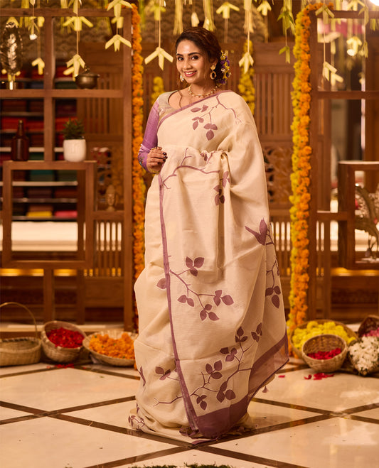 Cream colour Tussar cotton Kota saree featuring delicate Block printed leaves motifs across the body, highlighted with a subtle lavender border, paired with a matching blouse