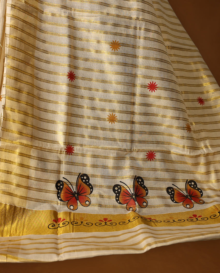 Elegant off white tissue Kerala saree featuring golden stripes and vibrant orange butterfly motifs, enhanced with a traditional golden zari border, offering a graceful and artistic look, paired with a matching blouse.