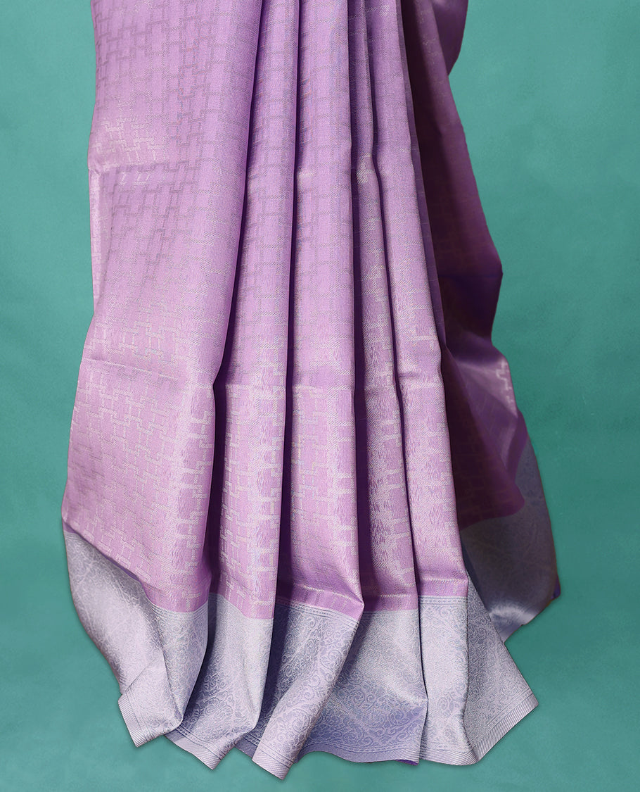 Violet coloured semi silk saree featuring a Silver coloured Zari design on the body, paired with a Baby Blue coloured border and matching blouse.