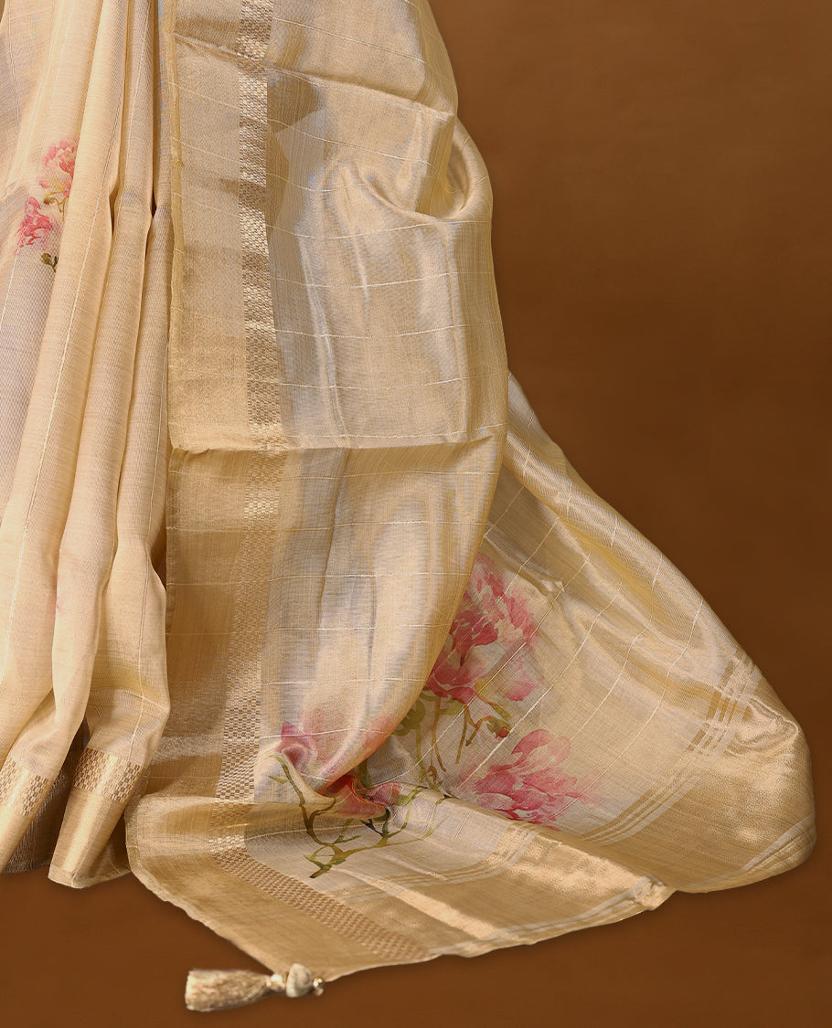 Radiant gold organza Kerala saree adorned with delicate floral accents, a shimmering zari border and a matching blouse