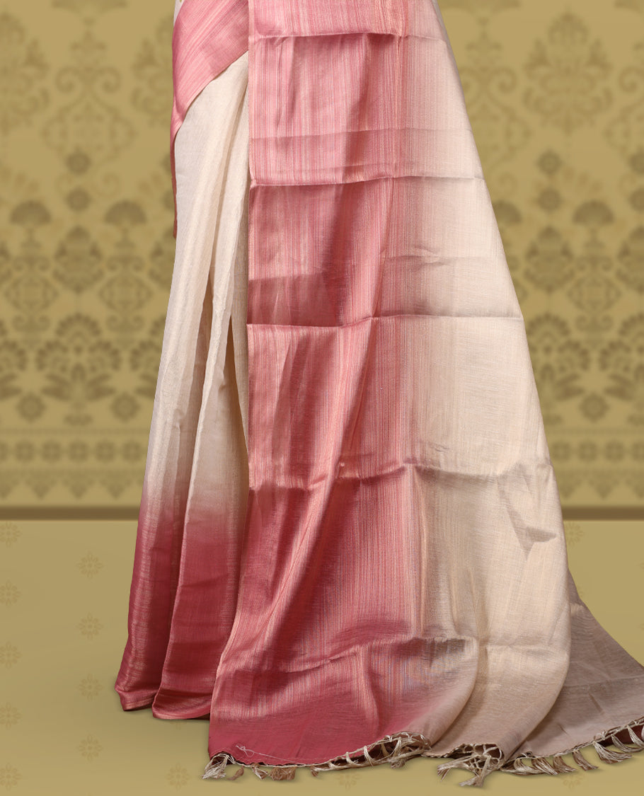 Beige and rose pink colour saree featuring a soft woven texture & The shaded pink pallu enhances its elegant drape & Finished with neat tassels and paired with a matching blouse piece.