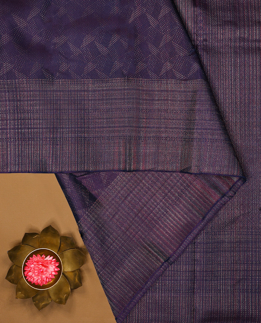 Dark Royal Purple coloured Manthrakodi saree featuring a multicoloured zari jacquard body, complemented by a self coloured turning Banarasi border and a matching self coloured blouse.